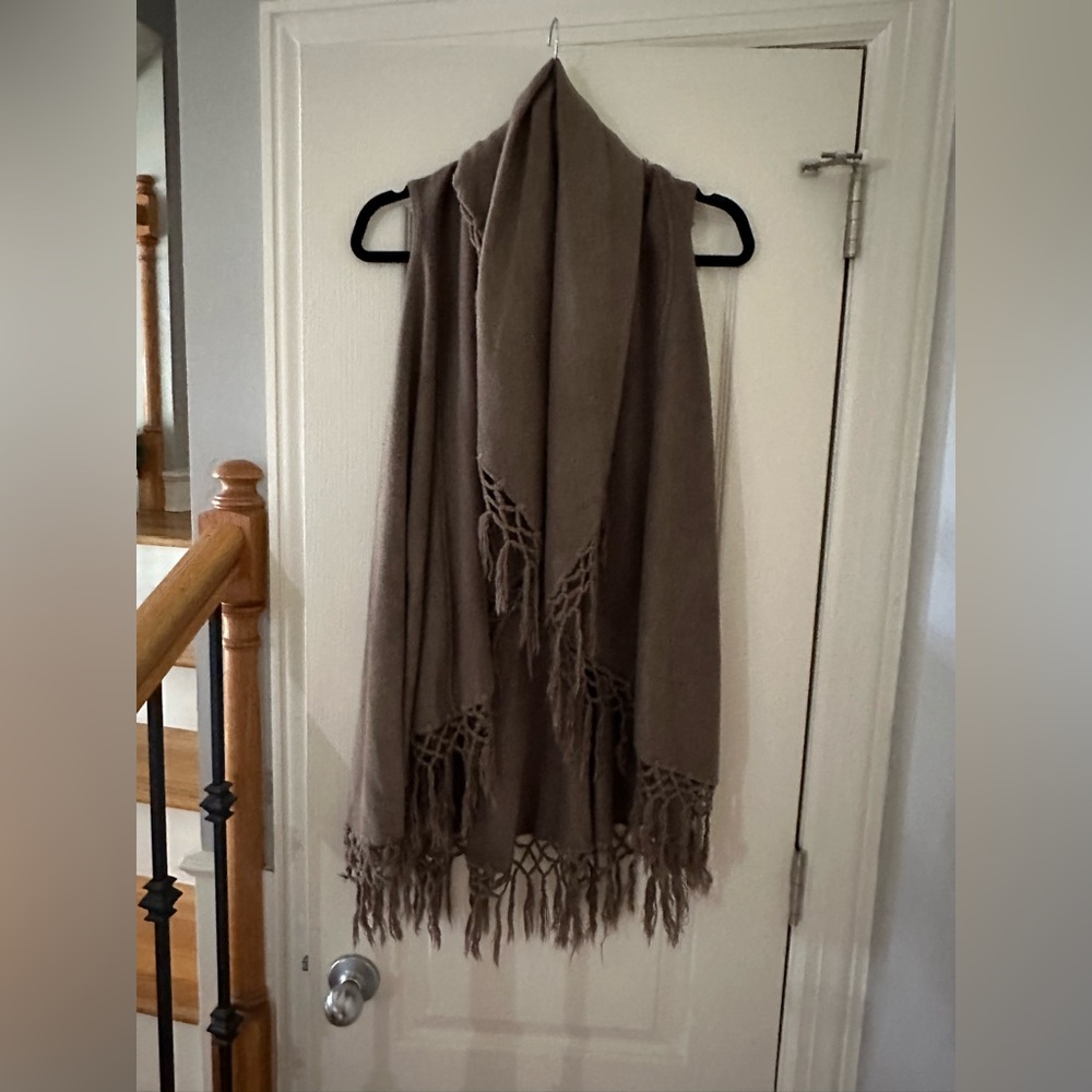 Fringe vest. Open front with no buttons. . One size.